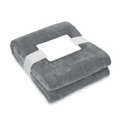 A folded grey blanket secured with a white band, featuring a blank label in the centre.