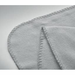 A soft grey fleece blanket with a stitched edge, folded to showcase its texture and detailing.