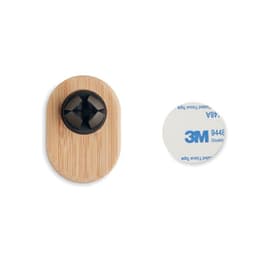A black and wooden wall mount with a circular adhesive disc beside it. The product includes a logo.
