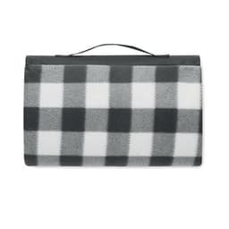 A picnic blanket in a black and white checkered pattern, featuring a handle for easy carrying.