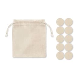 A cotton drawstring pouch in natural colour with ten plain circular tokens beside it.