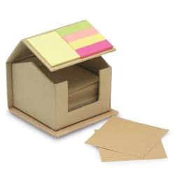 A small, cardboard house-shaped container filled with plain sheets and colourful sticky notes in pastel shades.