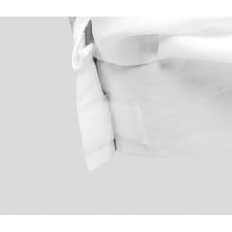 A white chef's hat made of fabric, featuring a textured band and a velcro fastening. It has a sleek design.