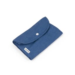 A foldable bag in dark blue, made from cotton and recycled materials, featuring a button closure and small logo.