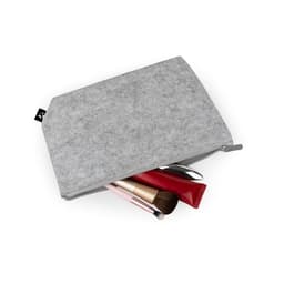 A grey multi-purpose bag made of recycled felt, partially filled with cosmetics and a makeup brush.