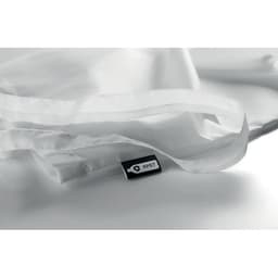 A lightweight, transparent tote bag in white, featuring a small tag with a logo.