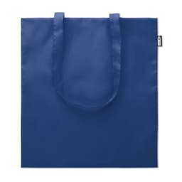 A blue tote bag with two handles and a logo on one side. The bag features a simple, solid design.
