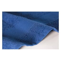 A blue towel with textured stripes displayed flat on a surface, showcasing its thick, plush fabric.