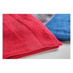 A stack of soft towels in red, blue, and grey, with a visible texture and folded edges.
