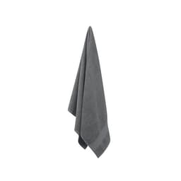 A grey towel hangs neatly, showcasing its plush texture and classic triangular shape.