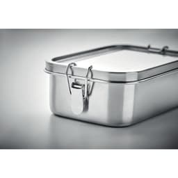 A silver lunchbox with a metal latch and a rectangular shape, featuring a polished finish.
