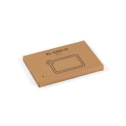 A bamboo cutting board with a built-in corner handle, packaged in a simple cardboard box.