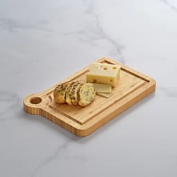A bamboo cheese board featuring a built-in corner handle, displaying slices of bread and cheese.