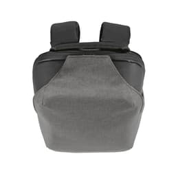 A grey backpack with a TSA lock and anticut fabric, featuring two shoulder straps and a compact design.