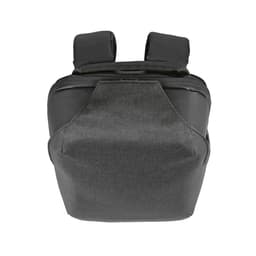 A grey backpack with a TSA lock and anticut fabric, featuring padded shoulder straps and a simple design.