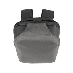A grey and black backpack featuring a TSA lock and anticut fabric, with padded shoulder straps and a logo.