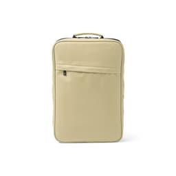 A beige backpack featuring a front pocket, suitable for a 17" laptop, and includes a logo.