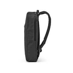 A black Amsterdam Backpack with slim design, featuring a side zipper and a strap, made from rPU and rPET materials.