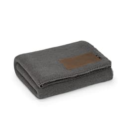 A folded grey blanket made from a rPET and wool blend, featuring a customisable patch. It includes a branding label.