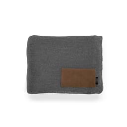 A grey blanket made from rPET and wool blend, featuring a customisable patch and a small branding label.