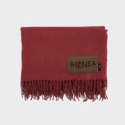 A maroon Lichtenstein blanket made from rPET, featuring a fringed edge and a customisable patch.
