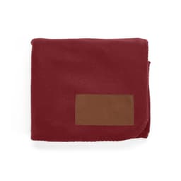 A maroon blanket made from rPET fabric, featuring a customisable brown patch.