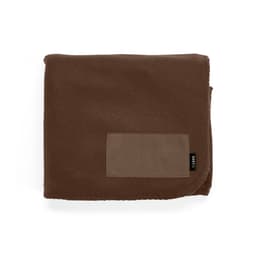 A brown fleece blanket made from rPET, featuring a customizable patch and a small black label.