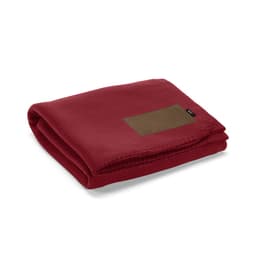 A folded red blanket made from rPET fabric, featuring a customisable brown patch. It has a branding logo.
