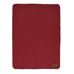 A red fleece blanket with a customisable patch and a small logo in one corner.