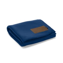 A folded blue blanket made from rPET fabric, featuring a customisable brown patch.