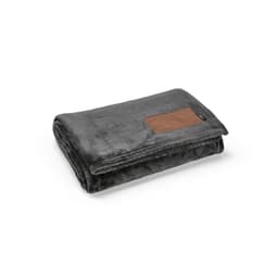 A soft, grey blanket with a brown customisable patch, neatly folded. It features a logo on the edge.