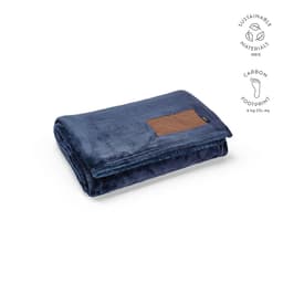 A dark blue blanket made from sustainable materials, featuring a customisable patch of brown fabric.