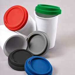 A drink bottle with a white ceramic body and coloured lids in red, green, grey, and blue. It has a logo.