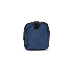 A blue gym bag with a rectangular shape, featuring reflective strips and one side pocket. It has a logo.