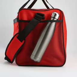 A red gym bag featuring a grey stainless steel drink bottle and a black strap. It has a logo on the front.