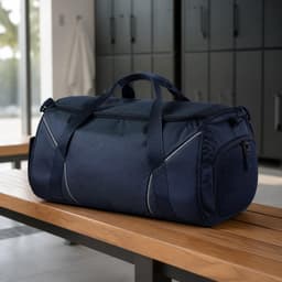 A navy blue gym bag featuring reflective strips and a mesh pocket, placed on a wooden bench in a fitness environment.