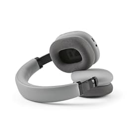 Grey headphones with cushioned ear pads and a flexible band, featuring a sleek design and a logo.