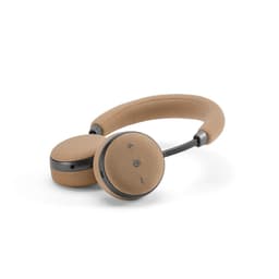 A pair of tan headphones with a soft fabric finish and adjustable headband, featuring a sleek design and controls.