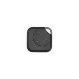 A black VibeTag tracker with a rounded square shape, featuring a small slot and a logo on the surface.