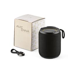 A black wireless speaker with a textured surface, accompanied by a USB charging cable and a patterned box.