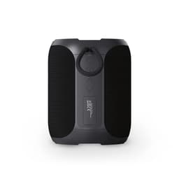 A black portable speaker with textured surfaces and a hanging loop for easy transport. It features a logo on the front.