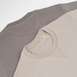 A crew neck sweatshirt in beige and brown colours, made from 100% organic cotton, featuring a logo.