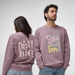 A mauve sweatshirt featuring various colourful graphics and a logo, displayed on a male and female model.