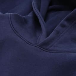 A navy oversized hooded sweatshirt made from organic cotton and recycled materials. Features a logo.