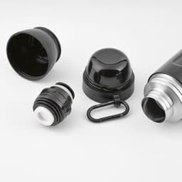 A drink bottle in black and silver, featuring a carabiner, two cups, and separate components.