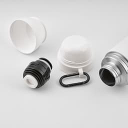 A drink bottle in white and silver, featuring a black cap, two white cups, and a black carabiner.