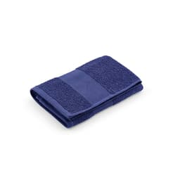 A folded navy towel made of cotton with a textured surface, featuring a logo.