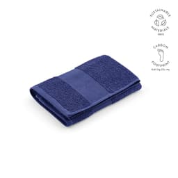 A folded navy blue towel made from sustainable cotton materials, featuring a textured design.