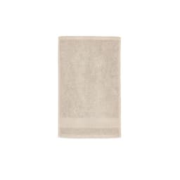 A light beige cotton towel with a textured surface, featuring a logo at the bottom. Made in Portugal.