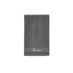 A grey towel with a textured surface and a branding logo at the bottom.